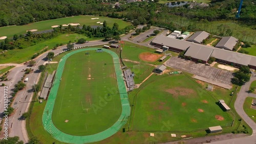 Aerial drone view of Destin FL middle school and the football field and the track.