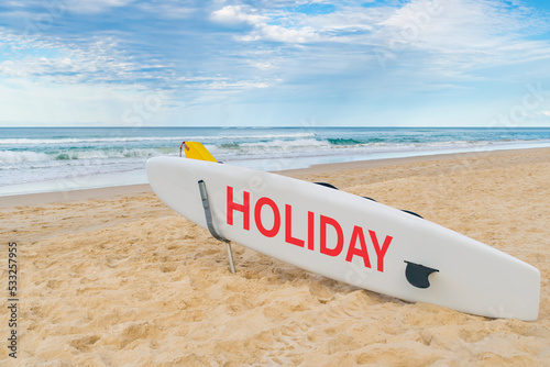 Surfboard on beach, holiday concept