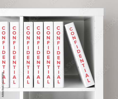 Confidential files in shelves, business concept