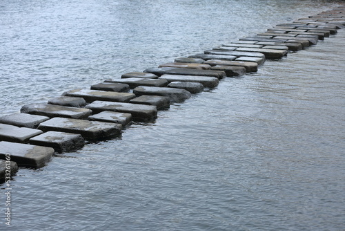 Landmark of Woldaecheon Stream in Jeju Island. stepping stone photo