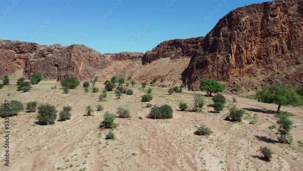 Scenic aerial landscape of a dry riverbed and mountain wilderness of northern Namibia Scenic aerial landscape of a dry riverbed and mountain wilderness of northern Namibia