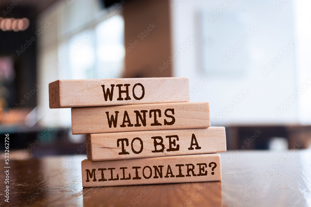 Wooden blocks with words 'Who Wants to Be A Millionaire?'. Wooden blocks with words 'Who Wants to Be A Millionaire?'.