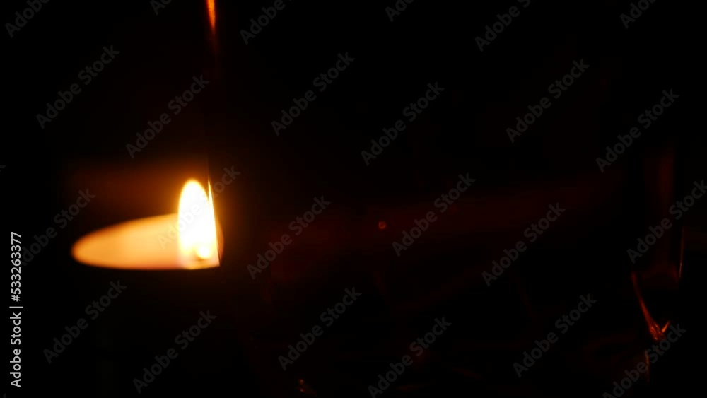 Abstract light effects with a glass of beer and a lit candle. Screensavers or background for music or titles. Bokeh and blur. Drops and bubbles Abstract light effects with a glass of beer and a lit candle. Screensavers or background for music or titles. Bokeh and blur. Drops and bubbles