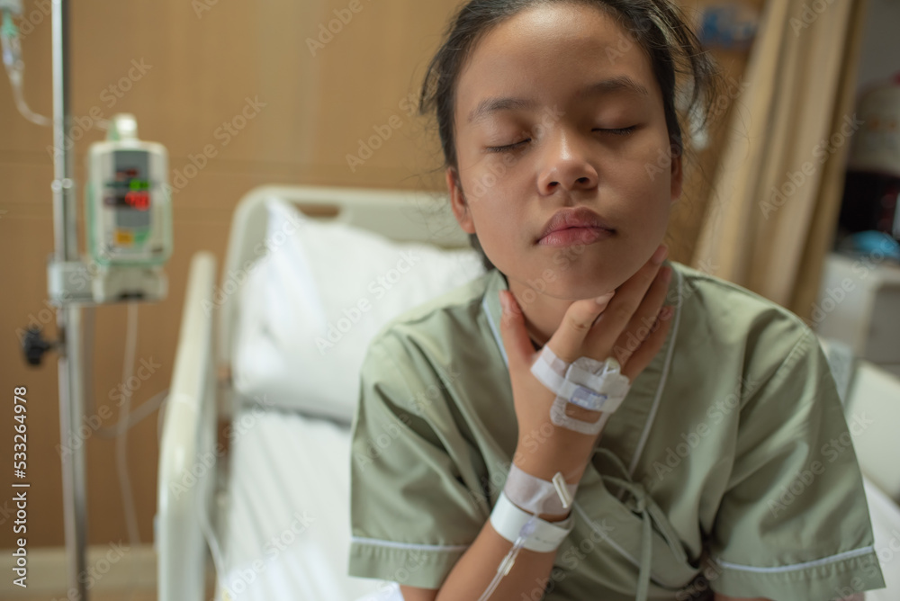 Asian beautiful female patient getting sick and fever, having sore throat and coughing while lying on bed in hospital, teenager sick with saline intravenous, healthcare and health insurance concept. Asian beautiful female patient getting sick and fever, having sore throat and coughing while lying on bed in hospital, teenager sick with saline intravenous, healthcare and health insurance concept.