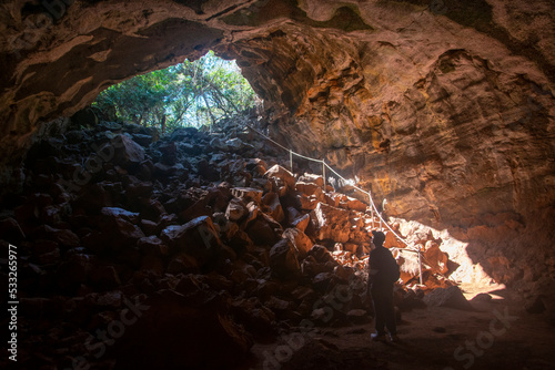 Looking out from inside Undara lava tube, Queensland, Australia photo