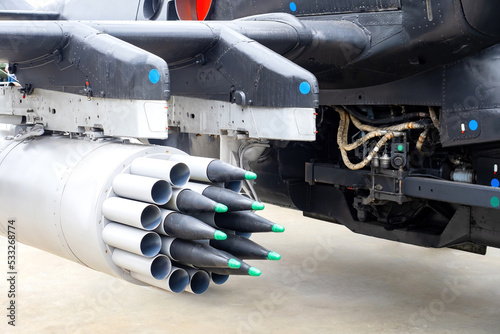 Military equipment. Block of unguided missiles. Module with missiles under wing of helicopter. Aviation missiles. Helicopter launch rockets. Military air equipment. Aerial bombs kit closeup photo