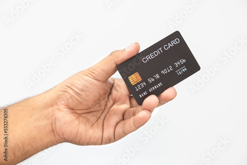 Close-up hand of Asian man holding black credit card in his hand. isolated on white background. Concept of finance, trading, communication, social, technology, business