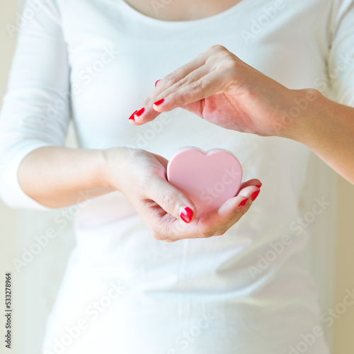 love concept. holding a red heart in hands.