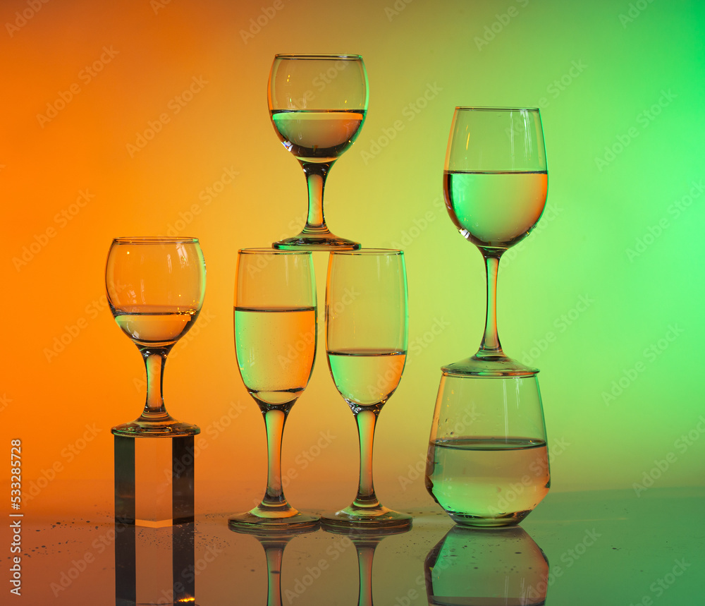Wine glasses with neon multicolor light Wine glasses with neon multicolor light