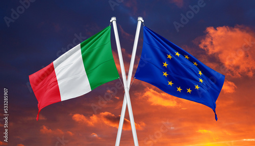 Italy flag and Europe flag waving together in isolated the blue sky background. Concept for financial treated, unique currency and financial bond. photo