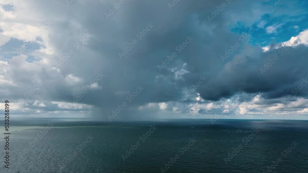 Beautiful Aerial Drone Shot of Huge Rain Cloud Raining over the Ocean Beautiful Aerial Drone Shot of Huge Rain Cloud Raining over the Ocean