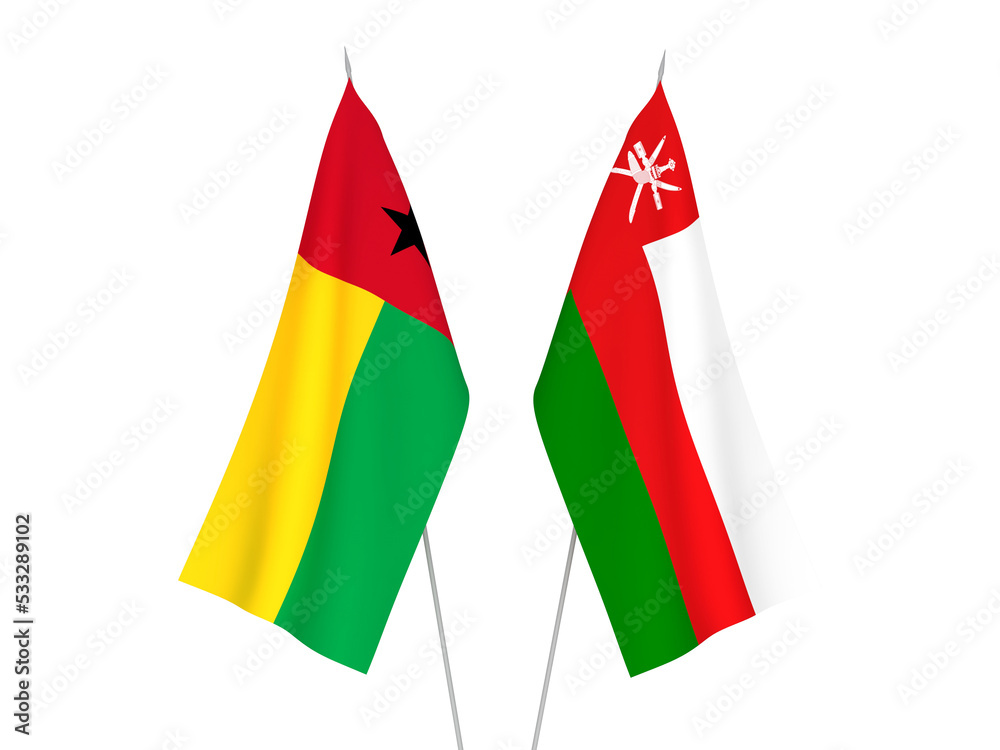 National fabric flags of Sultanate of Oman and Republic of Guinea Bissau isolated on white background. 3d rendering illustration. National fabric flags of Sultanate of Oman and Republic of Guinea Bissau isolated on white background. 3d rendering illustration.