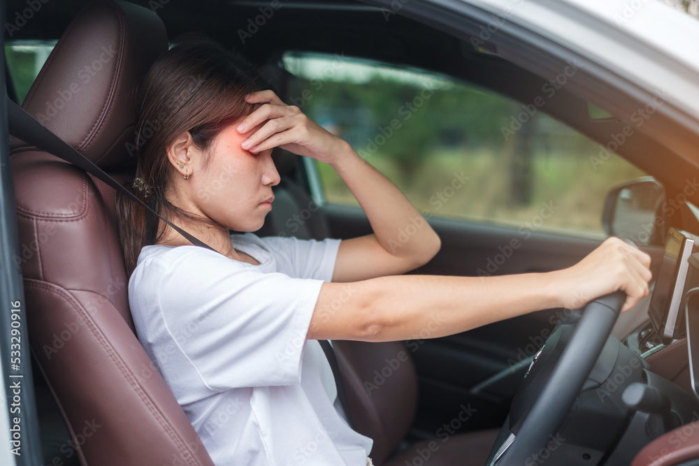 woman feeling stress and angry during drive car long time. Asian girl tired and fatigue having headache stop after driving car in traffic jam. Sleepy, stretching and drunk concept