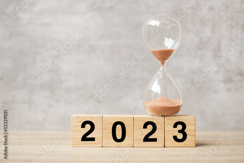 2023 text with hourglass on table. Resolution, time, plan, goal, motivation, reboot, countdown and New Year holiday concepts