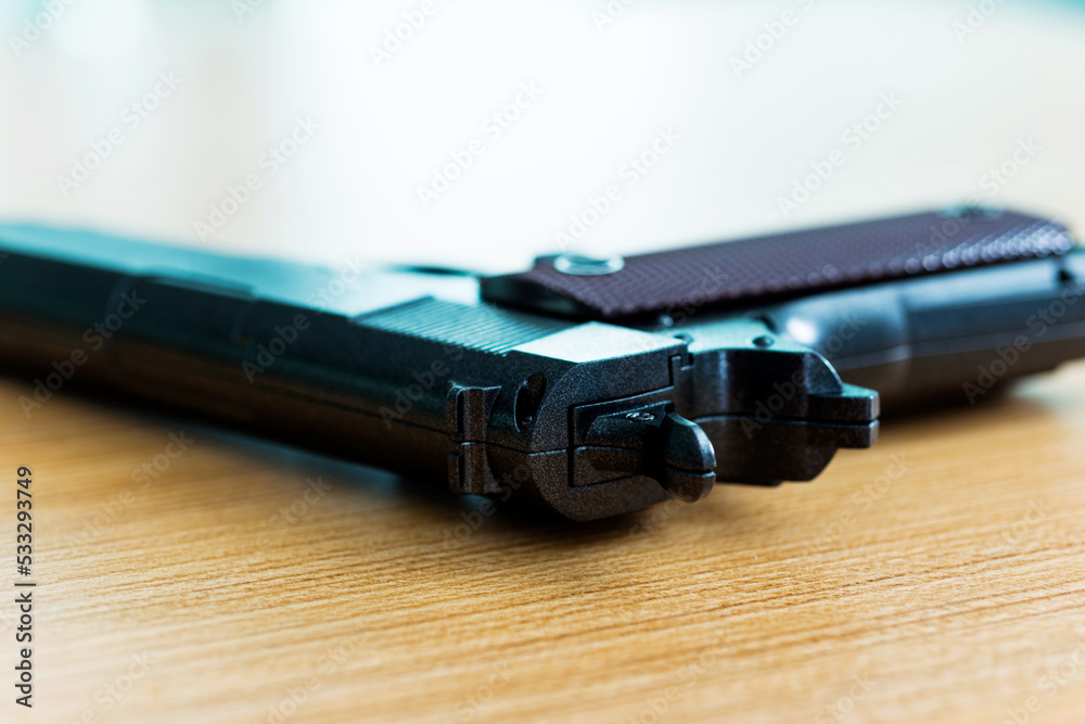 Black gun put on the table Black gun put on the table