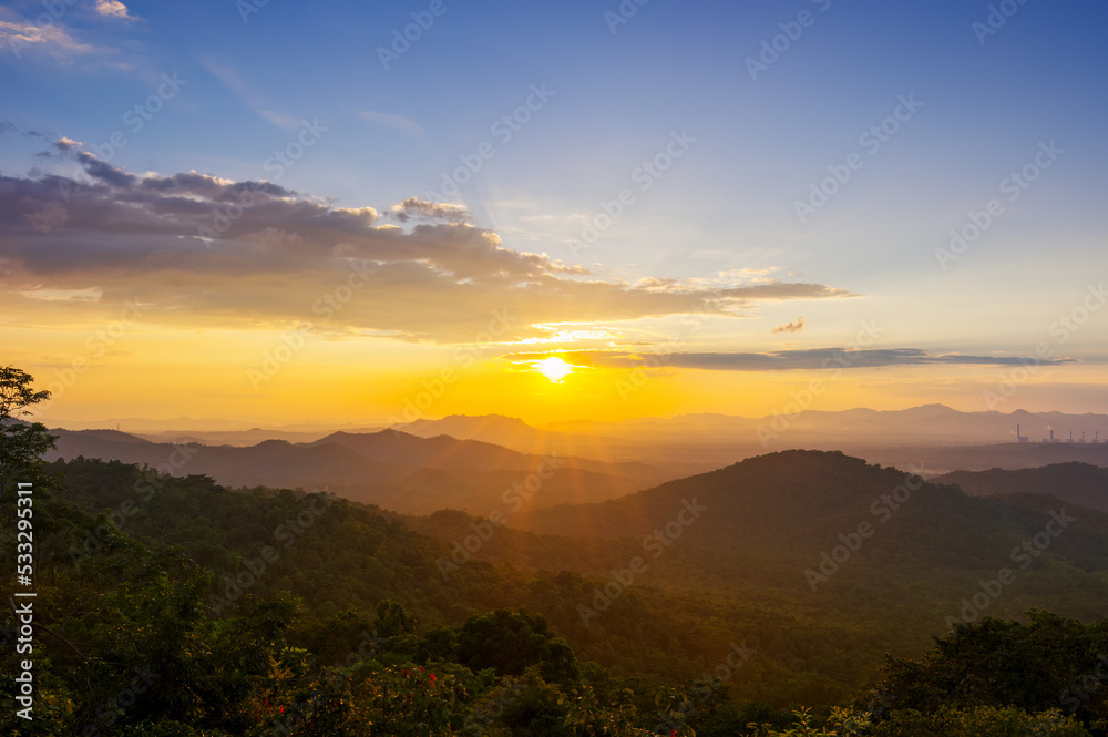 Beautiful  landscape sunset over peak Mountain with warm light Mae Moh  Lampang, Thailand.