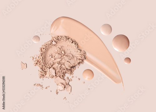 cosmetic smear foundation cream powder on a beige background