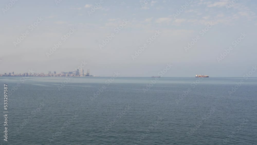Cargo ships at sea in Batumi carry cargo. Transport, logistics, business. Cargo ships at sea in Batumi carry cargo. Transport, logistics, business.