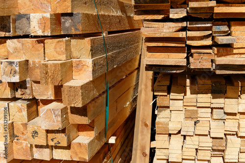 Wallpaper Mural Blocks of pine sawn timber for the construction of roof houses and cottages stacked on the lumberyards site, ready for sale Torontodigital.ca
