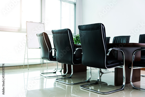 Empty conference room with table and chairs photo
