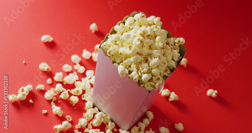 Image of close up of popcorn on red background