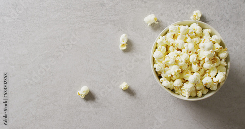 Image of close up of box of popcorn on gray background