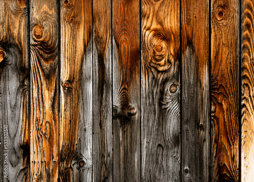 Rustic wood planks background for design. Dark hardwood weathered surface. Grungy faded timber wooden structure. 