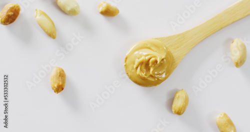 Image of close up of peanut butter on white background