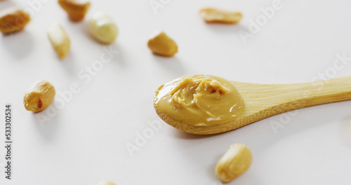 Image of close up of peanut butter on white background