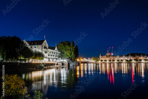 Germany, Baden-Wurttemberg, Konstanz, Shore of Lake Constance at night with city lights in background photo