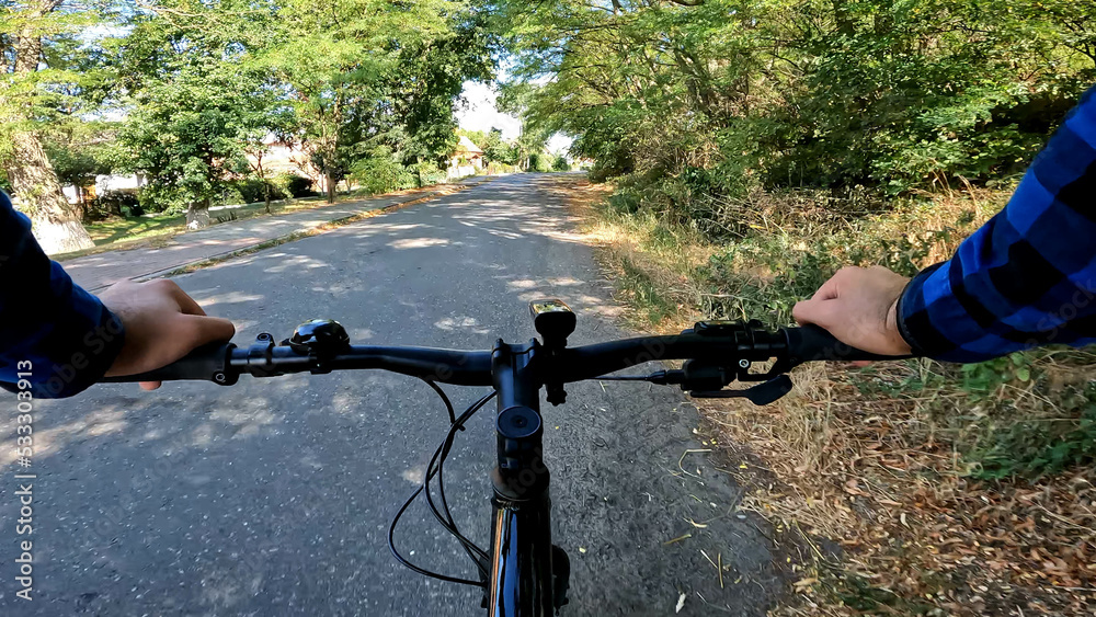 Gravel bicycle ride on the road in the summer season Gravel bicycle ride on the road in the summer season