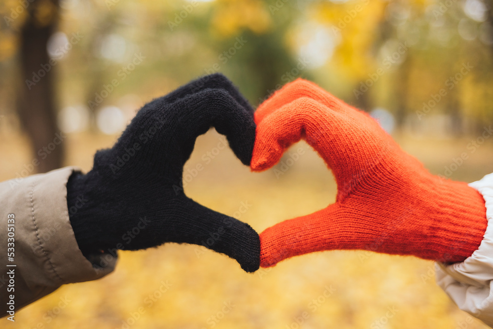 Hands with gloves making heart shape Hands with gloves making heart shape