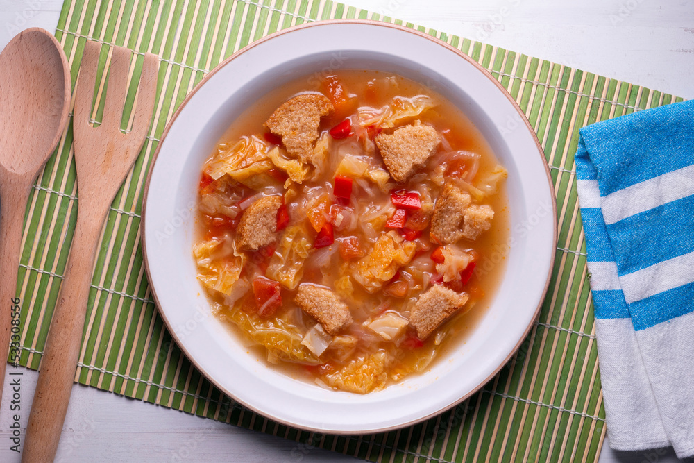 Menorcan soup. Traditional recipe from the island of Menorca in the Balearic Islands. Traditional tapas from the islands with bread, peppers and white cabbage. Menorcan soup. Traditional recipe from the island of Menorca in the Balearic Islands. Traditional tapas from the islands with bread, peppers and white cabbage.