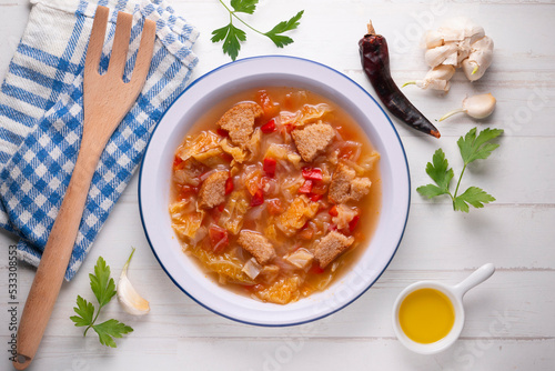 Menorcan soup. Traditional recipe from the island of Menorca in the Balearic Islands. Traditional tapas from the islands with bread, peppers and white cabbage. photo