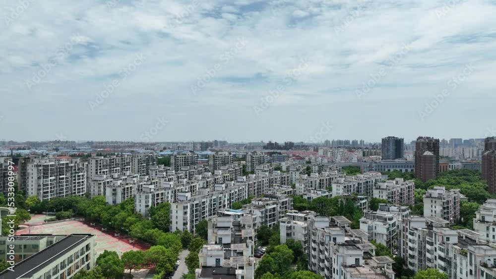 City landscape and apartment buildings. Drone aerial view. Drone flying over city in cloudy day. Cityscape and and the buildings in the city. Real estate, economy, business concept b-roll footage. City landscape and apartment buildings. Drone aerial view. Drone flying over city in cloudy day. Cityscape and and the buildings in the city. Real estate, economy, business concept b-roll footage.