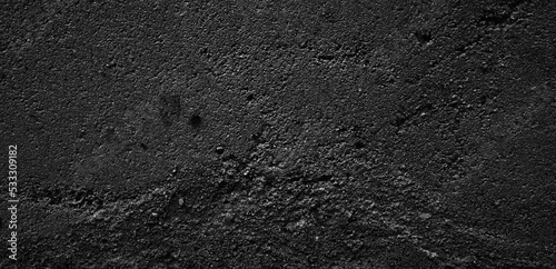 Black and white grunge texture. Black and white abstract distressed background. A faded surface covered with dirt, scratches, cracks.