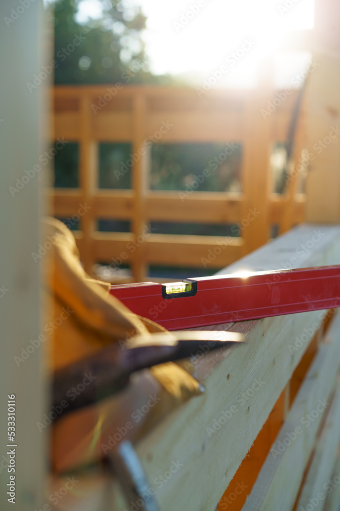 Close up of construction tools inside of unfinished wooden house. Close up of construction tools inside of unfinished wooden house.
