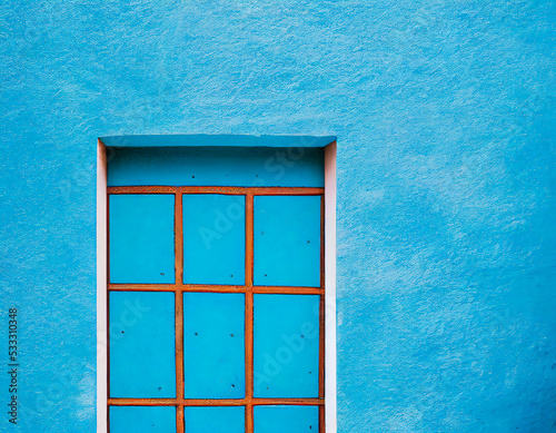 Door on a blue facade, minimalist, traditional architecture and decoration xxxxx, 3D rendering photo