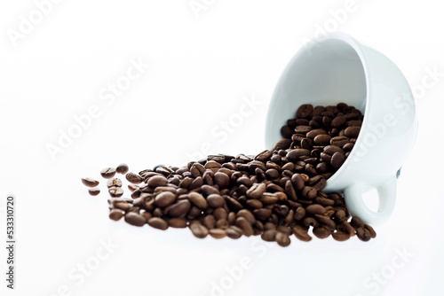 Coffee beans in cup isolated on white background