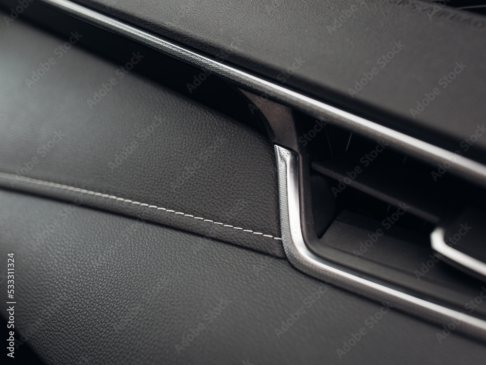 Modern luxury car leather panel close up Modern luxury car leather panel close up