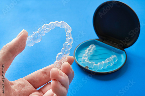 Transparent invisible dental aligners or braces applicable to orthodontic treatment and their containers.