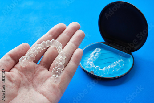 Transparent invisible dental aligners or braces applicable to orthodontic treatment and their containers.