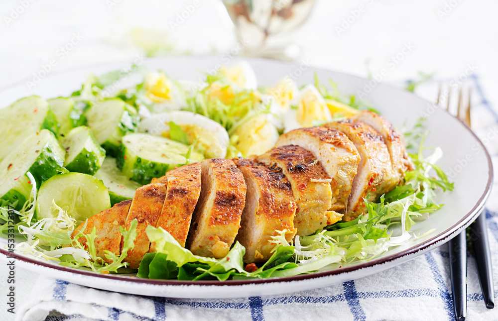 Grilled chicken meat and boiled eggs and fresh cucumber salad. Healthy keto, ketogenic lunch. Roasted chicken breast, fillet and fresh vegetable salad. Grilled chicken meat and boiled eggs and fresh cucumber salad. Healthy keto, ketogenic lunch. Roasted chicken breast, fillet and fresh vegetable salad.