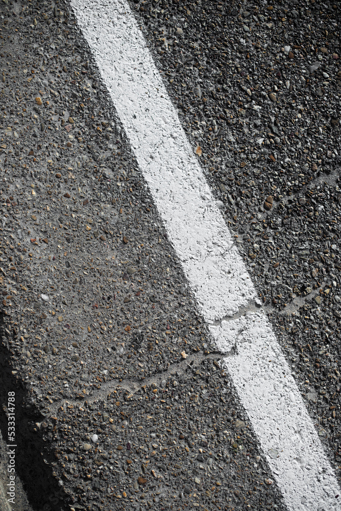 Fototapeta premium Roadside with a white painted line