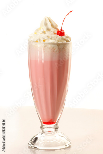 Berry milkshake. On a light background.
