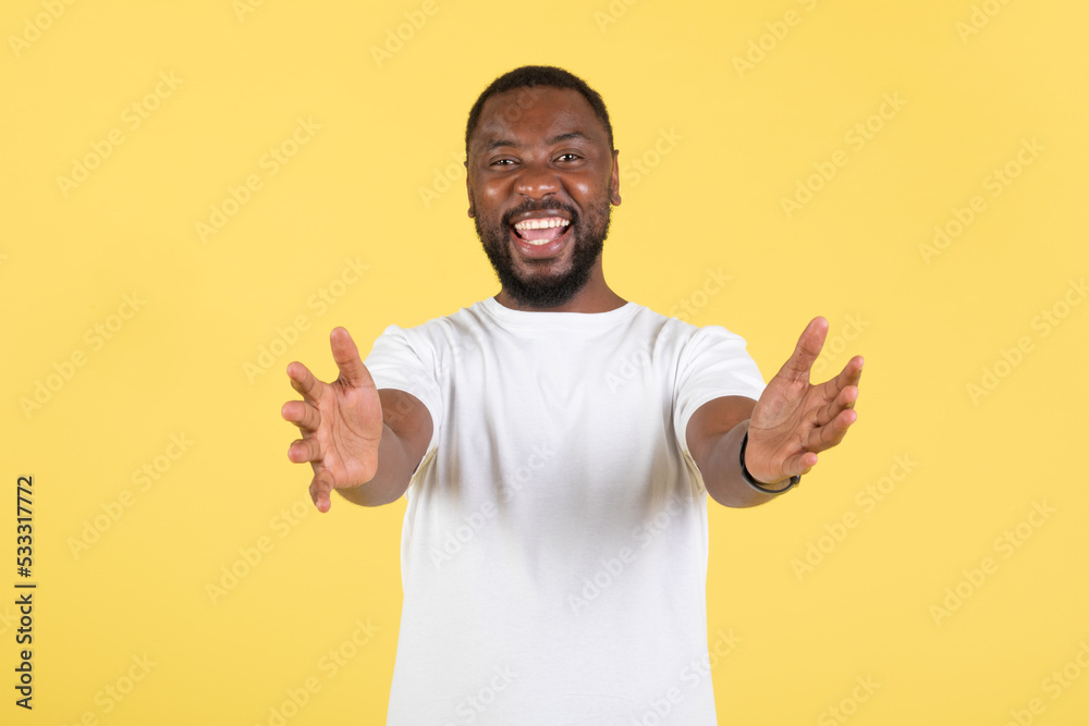 Joyful African Man Stretching Hands To Camera Over Yellow Background Joyful African Man Stretching Hands To Camera Over Yellow Background