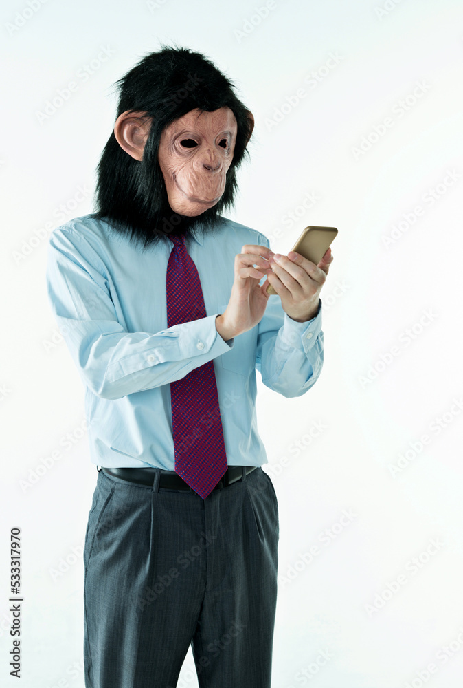 Businessman with head of monkey on white background Businessman with head of monkey on white background