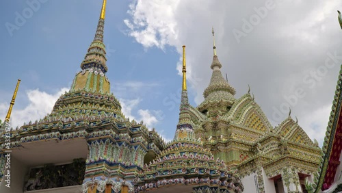 Footage exterior of  Buddhist temple and pagoda for Wat Phra Chetuphon Wimon Mangkhalaram Rajwaramahawihan as known as Wat Pho.  photo