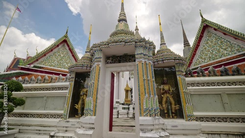 Footage exterior of  Buddhist temple and pagoda for Wat Phra Chetuphon Wimon Mangkhalaram Rajwaramahawihan as known as Wat Pho.  photo