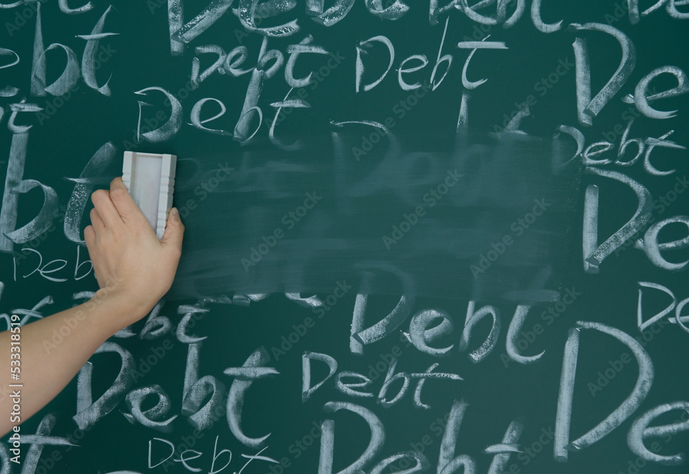 Wiping debt on a chalkboard Wiping debt on a chalkboard